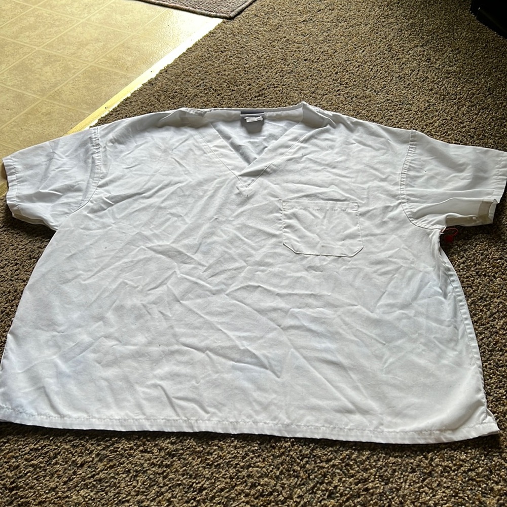 Nurse’s scrub top: color white, size medium and it’s from Medici collection  EWC
